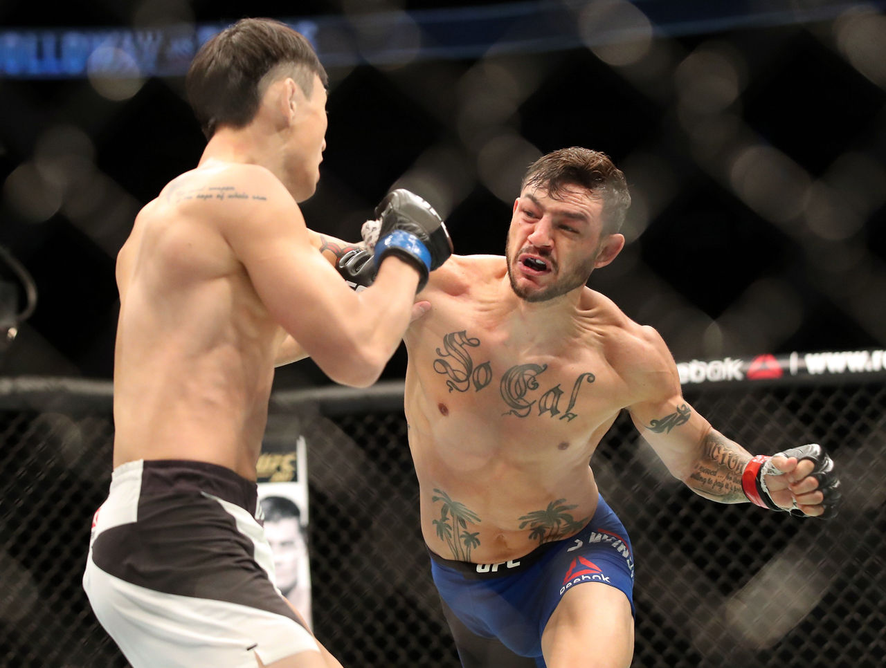 Swanson throwing a punch at Choi. / Source: The Score