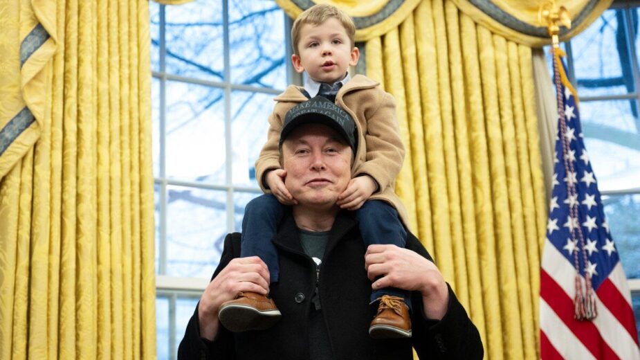 Elon Musk with his son X. src AFP